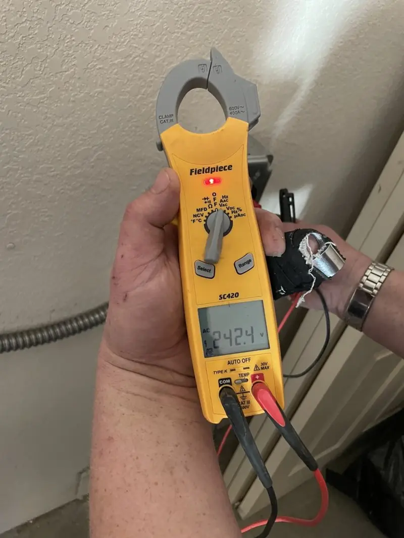 Voltage testing with clamp meter during Ceiling Fan Installation in Williams